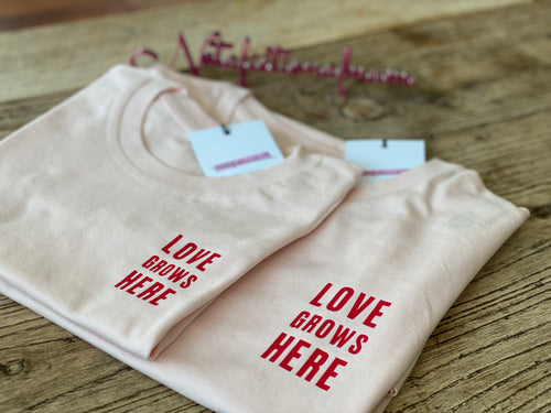 cream-matching-tshirts-love-grows-here-slogan-in-red