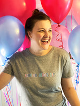 Load image into Gallery viewer, smiling-woman-wearing-adoption-shower-day-slogan-tshirt-with-balloons-one-of-the-items-from-the-adoption-clothing-range-from-notafictionalmum
