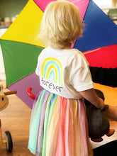 Load image into Gallery viewer, Child-wearing-forever-white-tshirt-rainbow-logo-with-tuttu-umbrella
