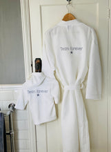 Load image into Gallery viewer, team-forever-white-bathrobes-hanging-on-door
