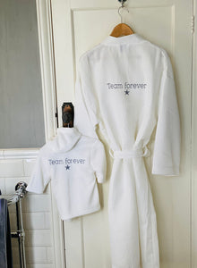 team-forever-white-bathrobes-hanging-on-door