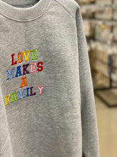 Load image into Gallery viewer, Love makes a family embroidered sweatshirt
