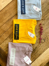 Load image into Gallery viewer, love-is-love-slogan-tshirts-folded
