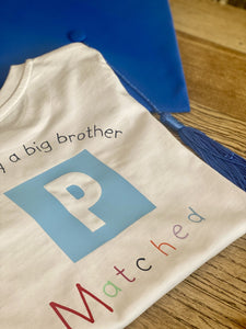Officially a big brother/sister matched T-shirt with matching graduation cap