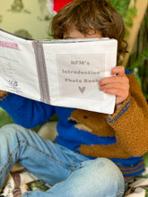 Load image into Gallery viewer, boy-reading-nfms-childrens-adoption-introduction-photo-book
