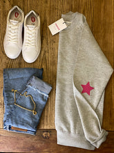 Load image into Gallery viewer, grey-chosen-sweatshirt-with-pink-heart-elbow-folded-with-jeans-white-trainers
