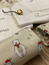Load image into Gallery viewer, christmas-polar-bear-pyjamas-christmas-bell-wooden-table
